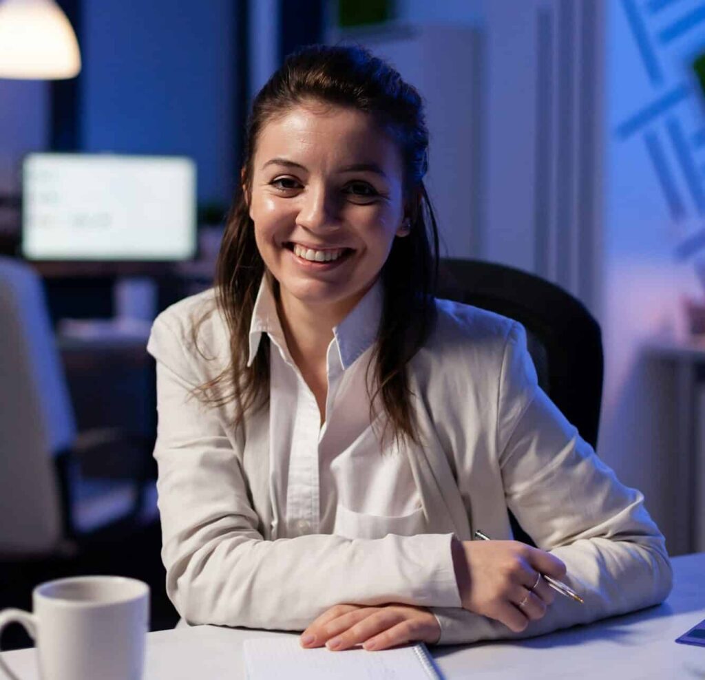 close up portrait of business woman smiling at camera e1715795709821